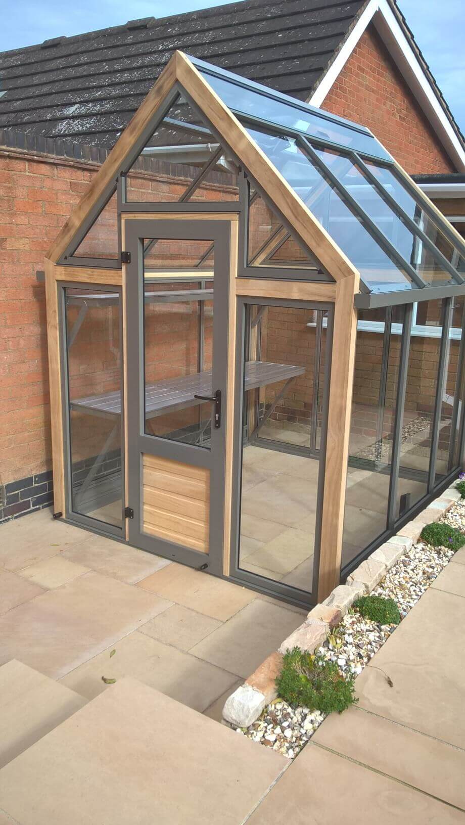 small wooden greenhouse